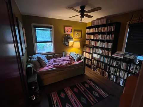 I turned my guest bedroom into a library, with a book closet and trundle bed