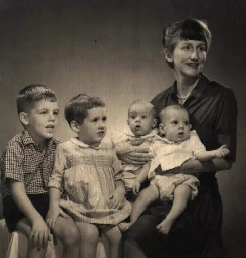 My mom had to pose with all four of us in one passport photo since we were under five years old (1965)