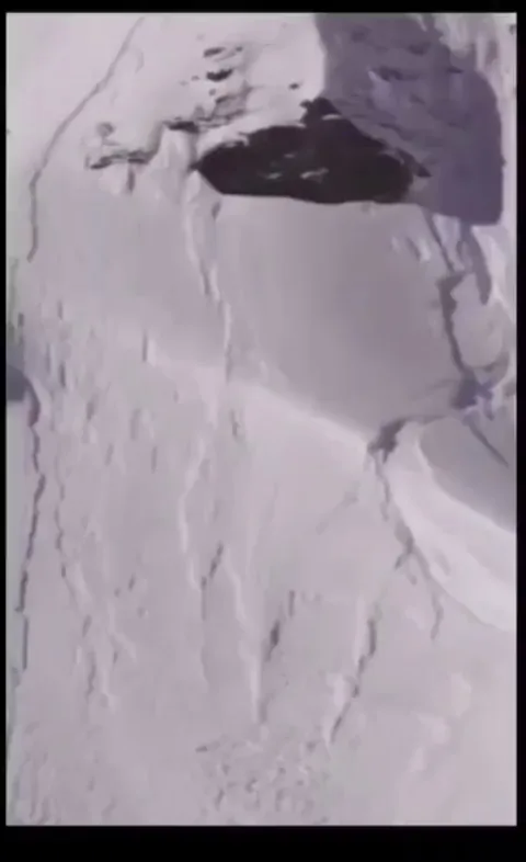 Guy outrunning an avalanche does a backflip