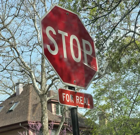 This Chicago stop sign asks drivers to stop “FOR REAL”