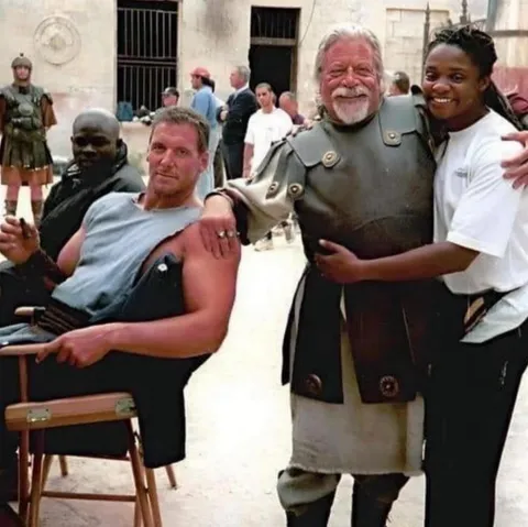 During the filming of Gladiator, Oliver Reed (Proximo) died in a bar after challenging a group of sailors to a drinking contest. Reed consumed 8 pints of beer, 12 shots of rum, half a bottle of whisky, and shots of cognac This photo of him was taken shortly before he died.