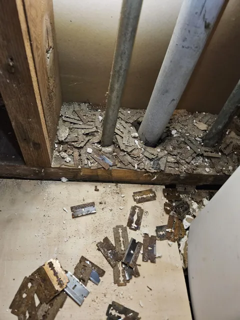 Found a used razor stash in the wall.