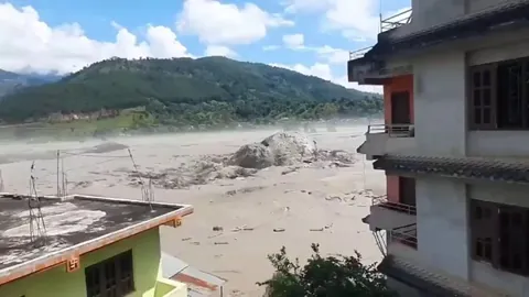 Huge boulder being swept by Flood-Nepal