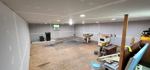 Finished the 2nd floor of my garage into a Home Theatre and Gym.