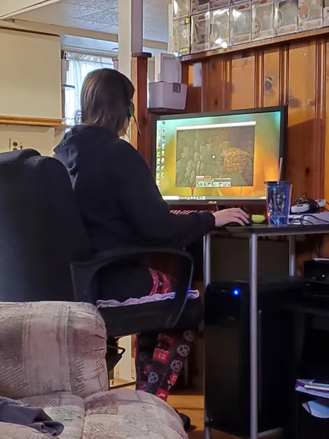 After spending more money than we can really afford on a gaming computer, my wife is playing Minecraft in windowed mode.