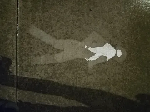 this pedestrian symbol has worn down into a miniature version of itself