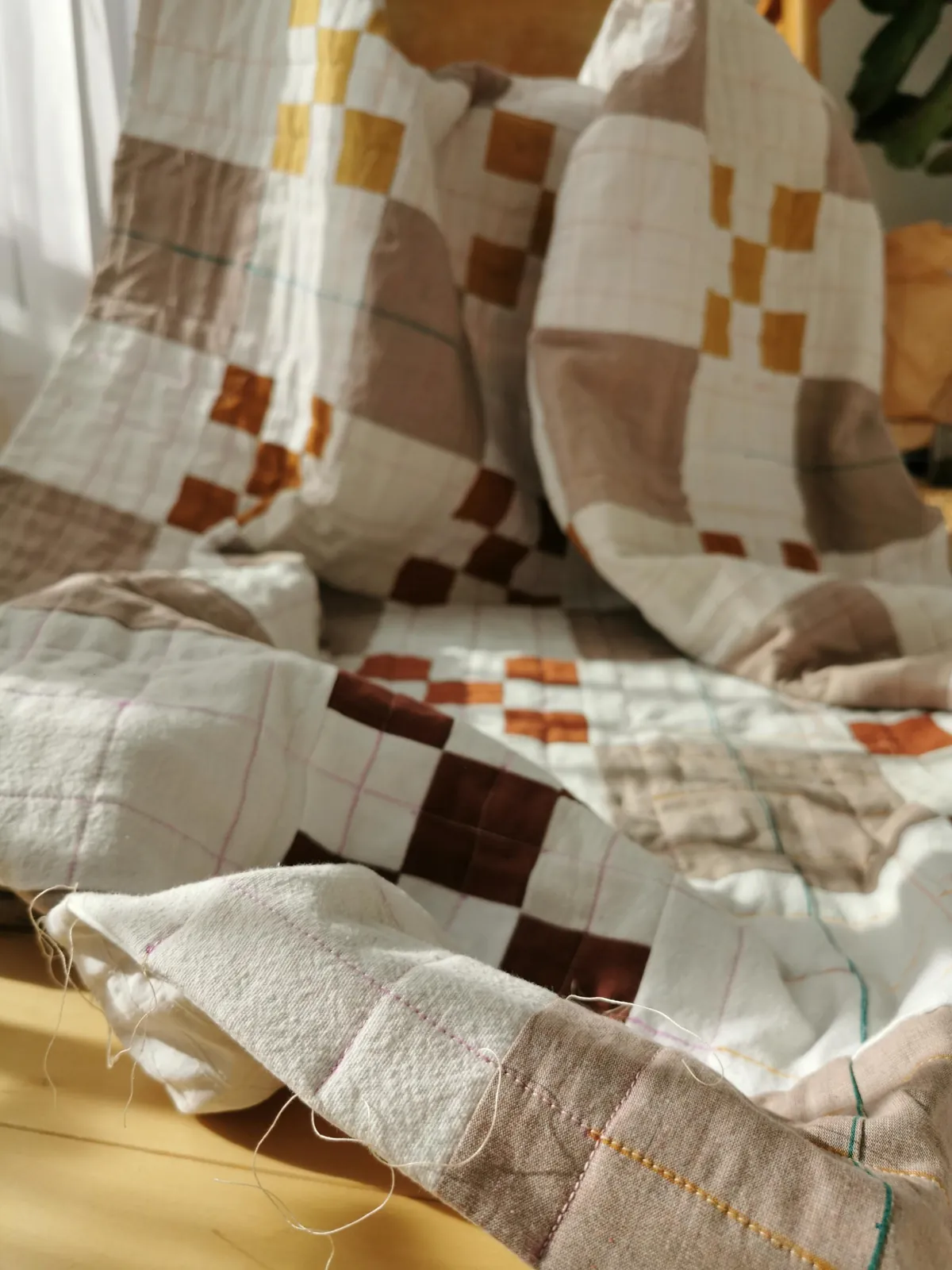 I taught myself to sew to make a cozy fall quilt for my bed. 90% thrifted fabric