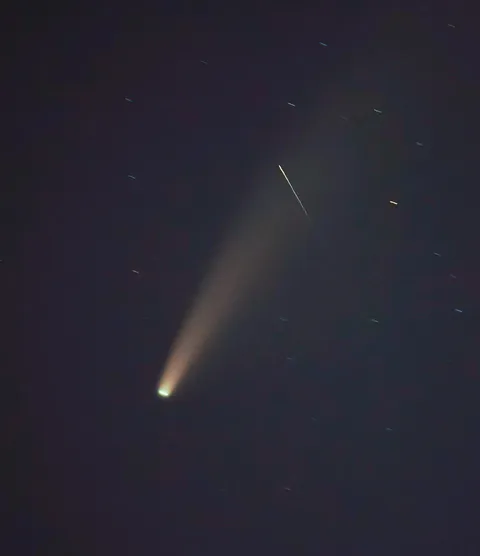 A shooting star crossing NEOWISE