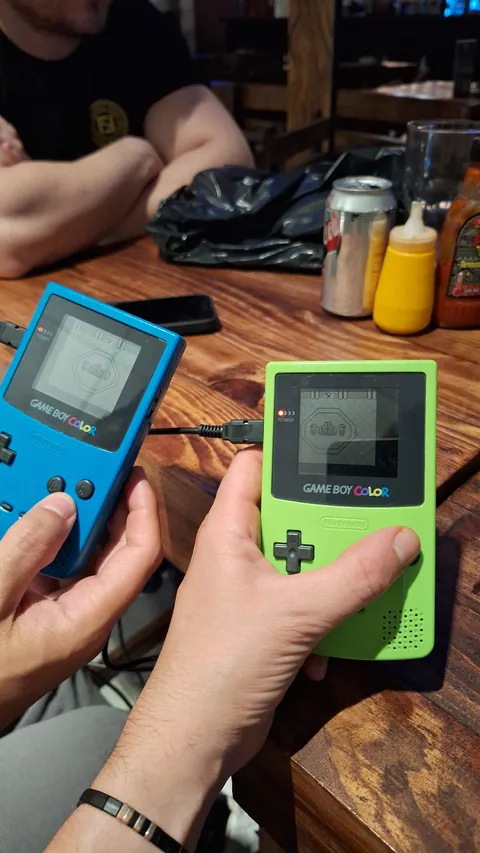 Just some friends doing some old school gaming (pokemon red and green) using cable link