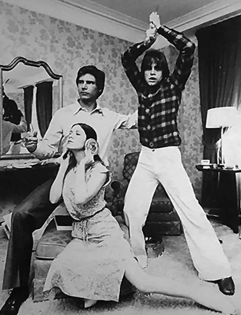 Harrison Ford, Carrie Fisher and Mark Hamill recreating the Star Wars poster in 1977