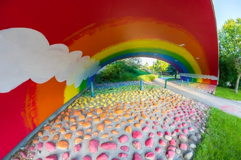 the underside of this bridge is painted like a rainbow
