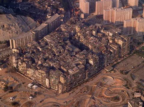 This is an 1989 photo of the Kowloon Walled City in Hong Kong. This ungoverned metropolis was only 6.4 acres in size but it was home to 50,000 residents and featured alleyways between buildings just 3 to 7 feet wide.