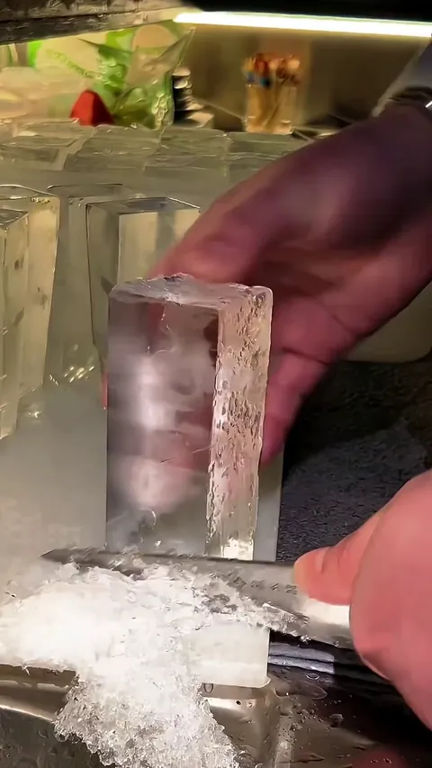 Precision ice cutting for cocktail glasses.