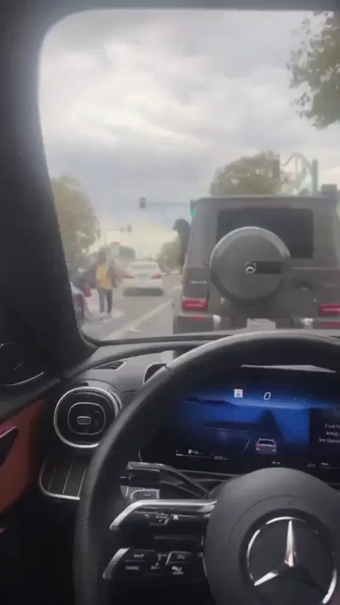 Wild scene in California when someone in a Mercedes launches bags, of what appears to be marijuana, out of the vehicle.