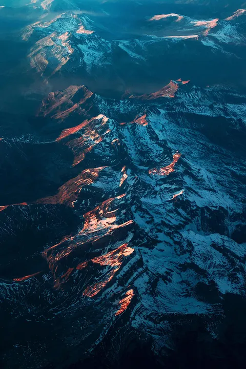 ITAP of a mountain range during sunset from the plane
