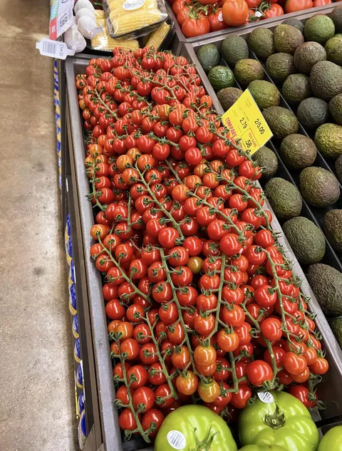 hang on… gotta call you back. i have to admire the tomato display at the grocery store [OC]