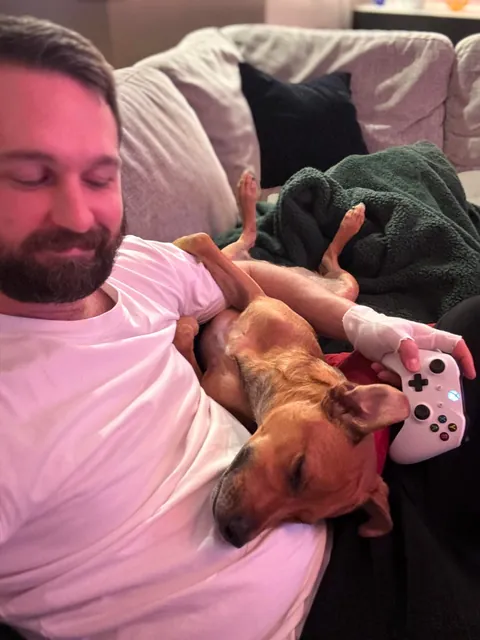 This is my cuddle monster Hector. His chin is on my shoulder as I post this