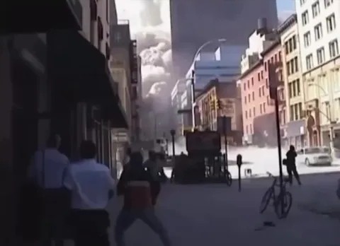 Shop owner saves woman from debris cloud on September 11, 2001.