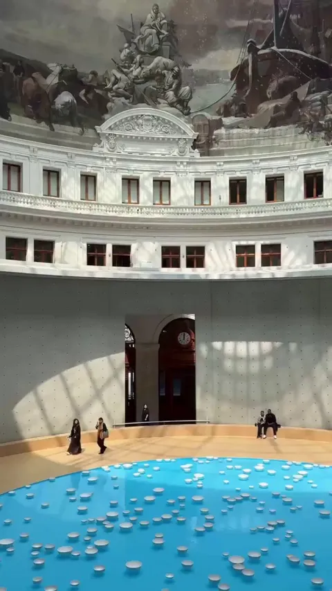 Porcelain bowls float and gently collide, creating a calming, random melody. This sound installation by Céleste Boursier-Mougenot fills the rotunda of the Bourse de Commerce, France.