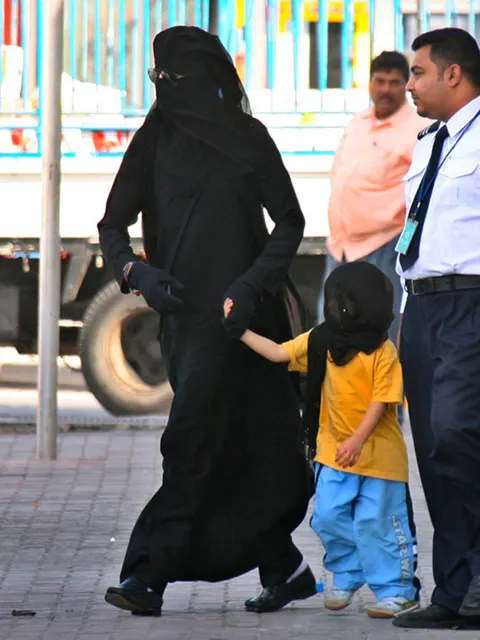 Michael Jackson wearing a woman's abaya for privacy in Bahrain, which would be strictly forbidden, but he was friends with the King of Bahrain's son (2006)