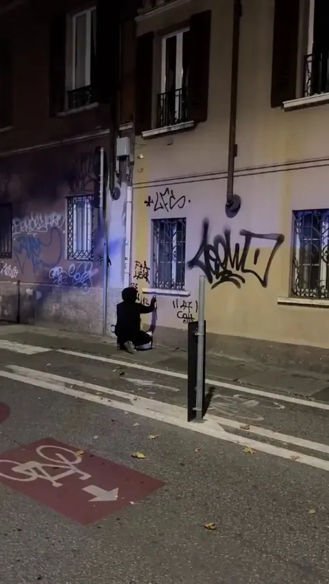 Ghost Pitùr (@ghostpitur) is an anonymous figure in Brescia, Italy, known as a "superhero" who cleans up vandalized walls by night.