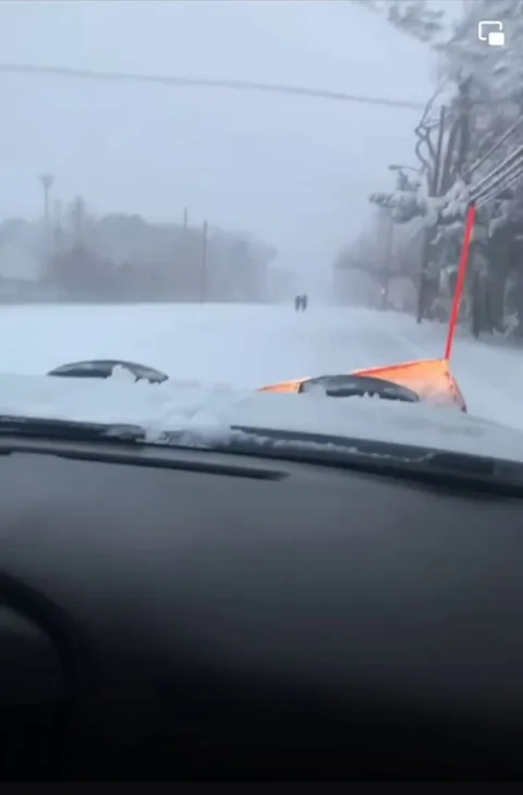 Idiot lowers snowplow as he pass two pedestrians to deliberately pile snow on them. Idiot is now suspended by the company he works for.