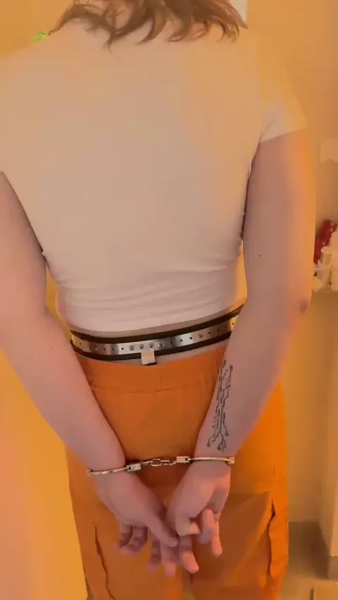 Cuffed cutie gets cleaned before lock up