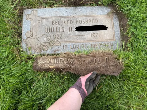 Grass roots on a relative’s grave took on the shape of the letters