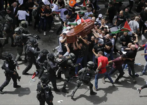 Israeli police beat coffin carrirers of Journalist Shireen Abu Akleh. East Jerusalem, 2022