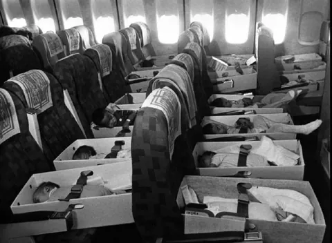 Babies who lost their parents during the Vietnam War being airlifted back to the United States for adoption, 1975.