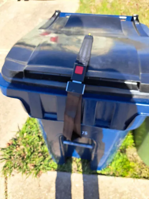 Tired of your trash cans getting blown open by the wind? Buy some seatbelts