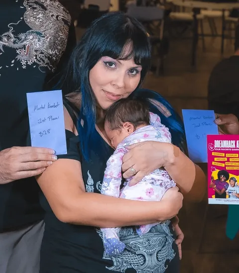 This mom gave birth less than a week ago… then won a Mortal Kombat tournament with her baby in her arms.