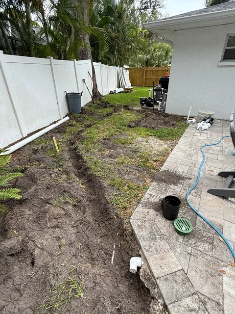 Hurricanes kept flooding my backyard so I buried 140ft of drainage pipe to prevent it.