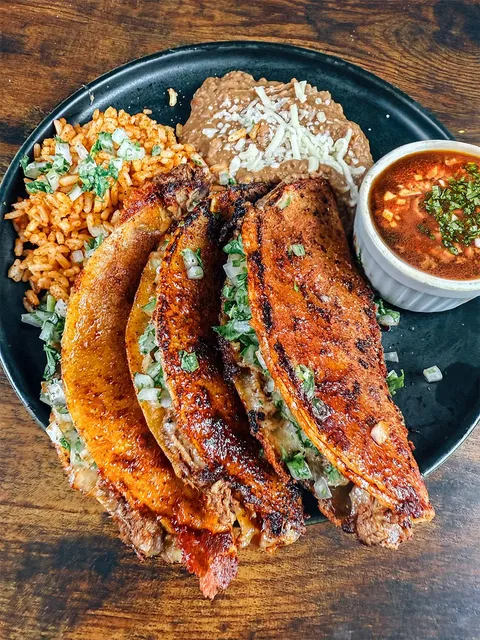 [Homemade] Crispy Birria Tacos with Consomé, Mexican Rice, and Refried Beans