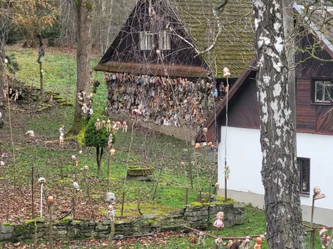 This house near my town. Many years ago it started "only" with hanged babies. Now there are heads on spikes and mannequins too.