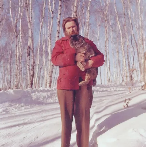 My Grandpa holding a bobcat - 1970s