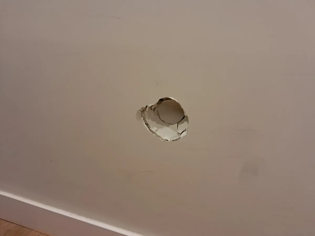 How can I fix this hole in the drywall before my father finds out???