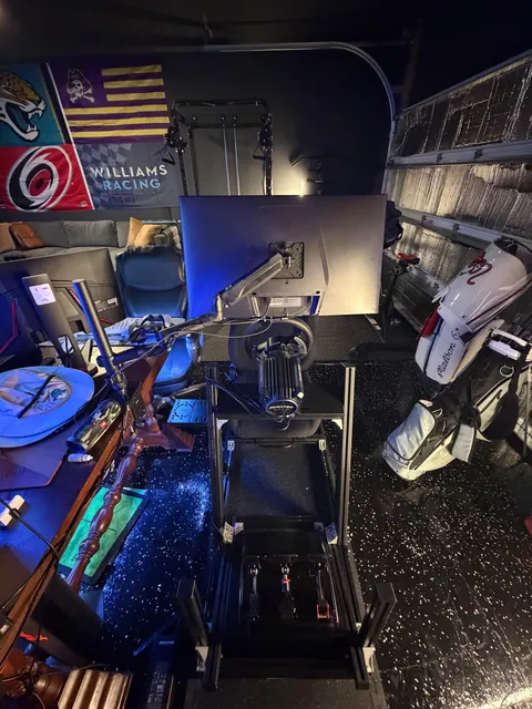 Basic two-car garage to a financial mistake I can hit golf balls and race in