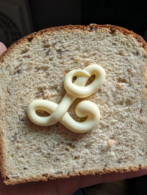 My mayo came out as a perfectly calligraphed "L"