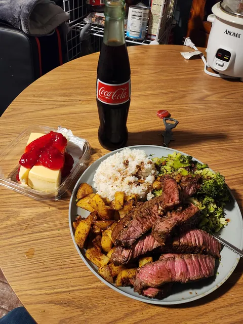 [homemade] steak, roasted potatoes, steamed broccoli, and jasmine rice. plus mexican coke and cheesecake from the store