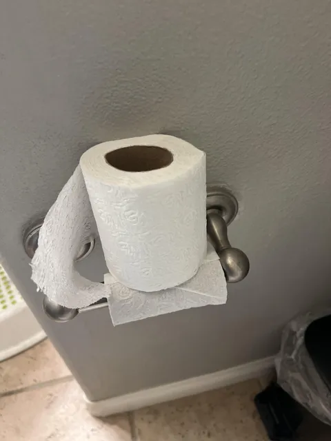 Husband won’t change toilet paper roll so he just balances a new roll on top of the old one that’s still clinging to its last square