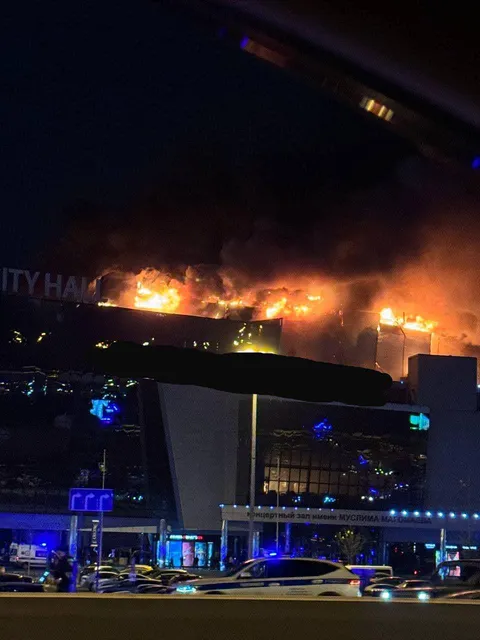 The roof of Crocus City Hall (Moscow) is burning after terrorist attack and some explosions indoor
