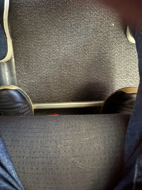 I am on a flight. I look down, these are not my feet.