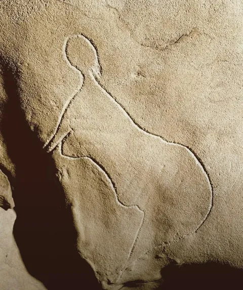 A stone drawing of a woman thousands of years old found in France
