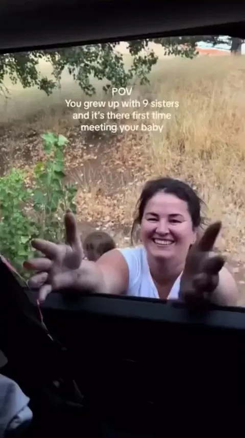 This baby is meeting his mom's nine sisters for the first time