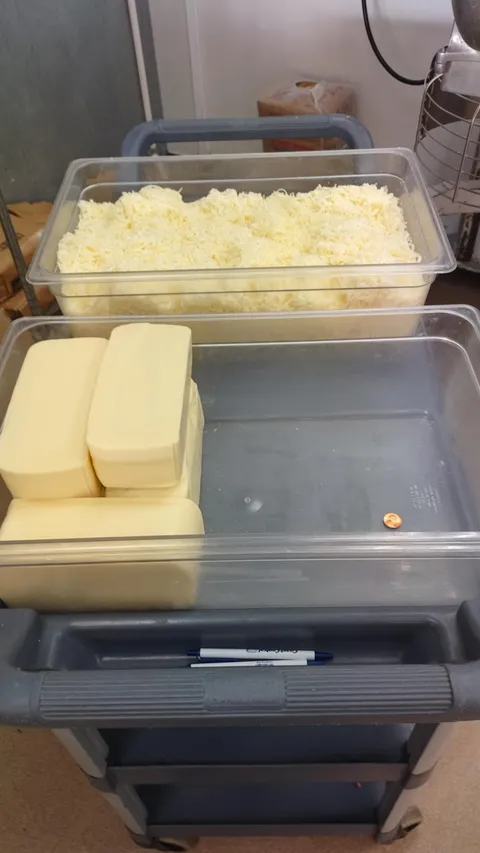The volume difference between 15lbs shredded and unshredded cheese