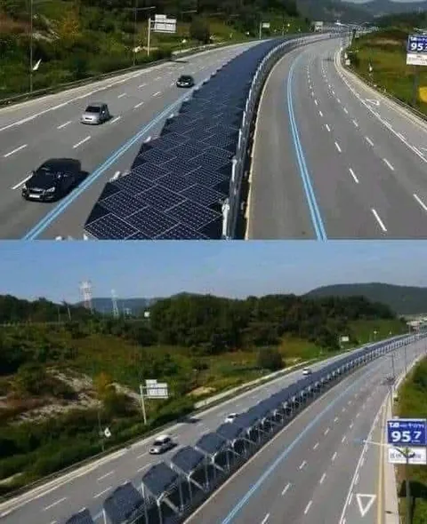 Highway in South Korea. Solar panels in the middle, with a cycle path underneath.