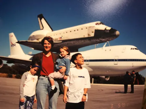 The family posing in front of shuttle Discovery before my dads launch