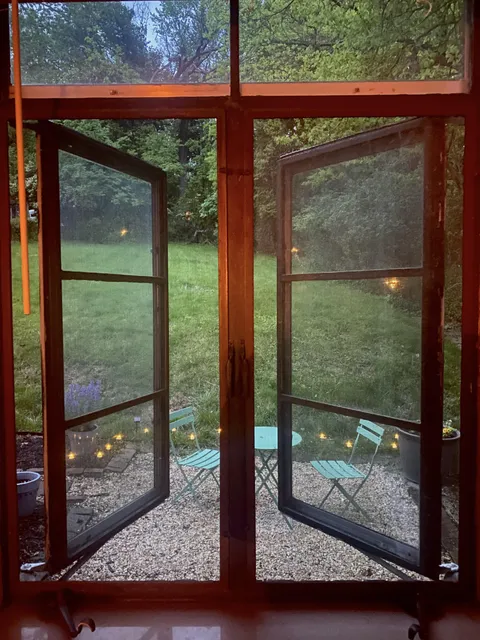 Backyard garden through casement windows