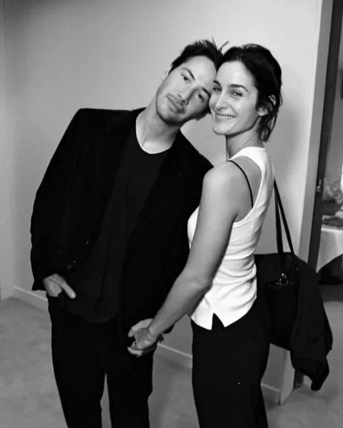 Keanu Reeves &amp; Carrie Anne Moss celebrating the release of "The Matrix", 1999